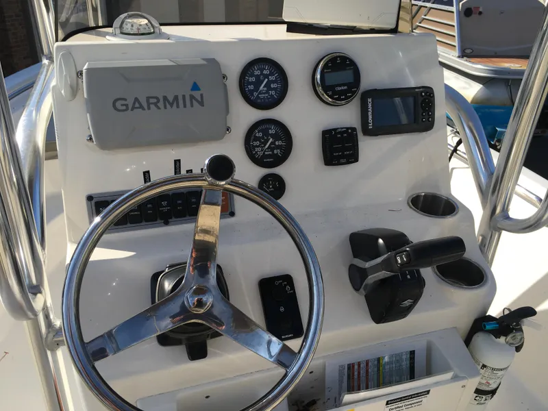 Slide: The Image of 2023 Key West 189 FS boat dashboard with Garmin navigation and control instruments. - 20