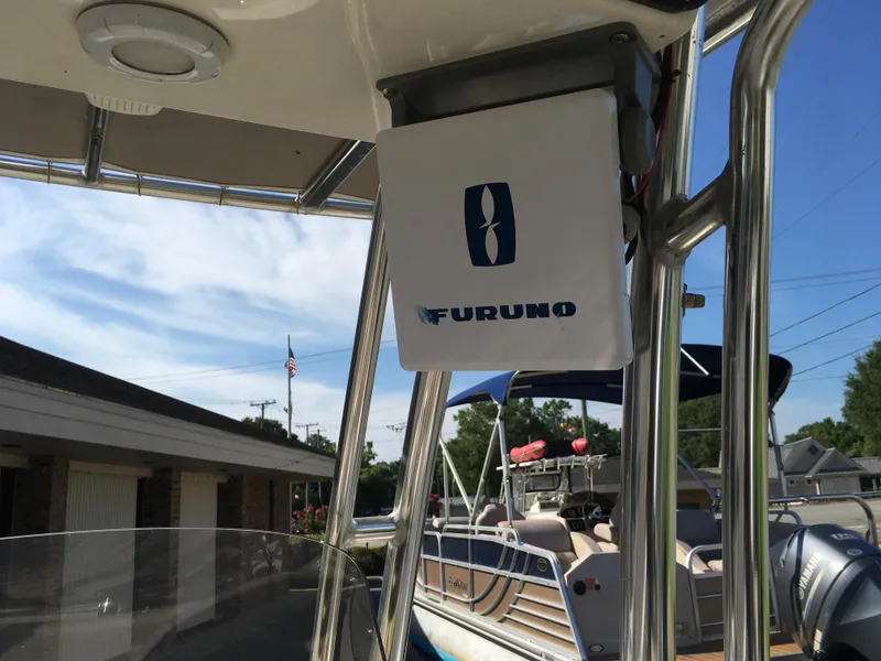 Slide: The Image of 2023 Key West 189 FS boat with Furuno equipment, docked under clear skies. - 22