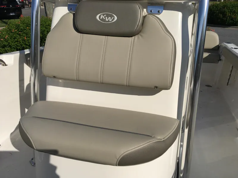 Slide: The Image of 2023 Key West 189 FS boat seat with beige upholstery and KW logo. - 26