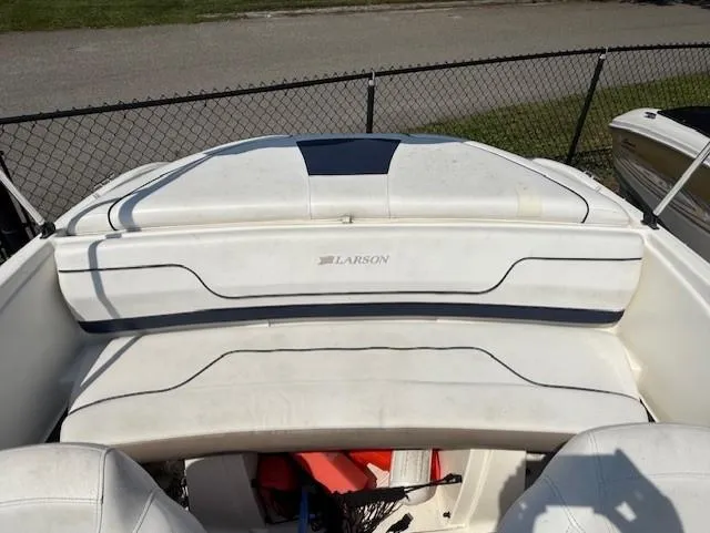 Slide: The Image of Larson LX 850 boat interior, 2011 model, featuring white seating and sleek design. - 10