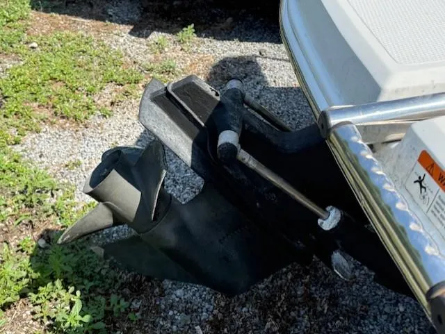 Slide: The Image of 2011 Larson LX 850 boat propeller on gravel and grass surface. - 3