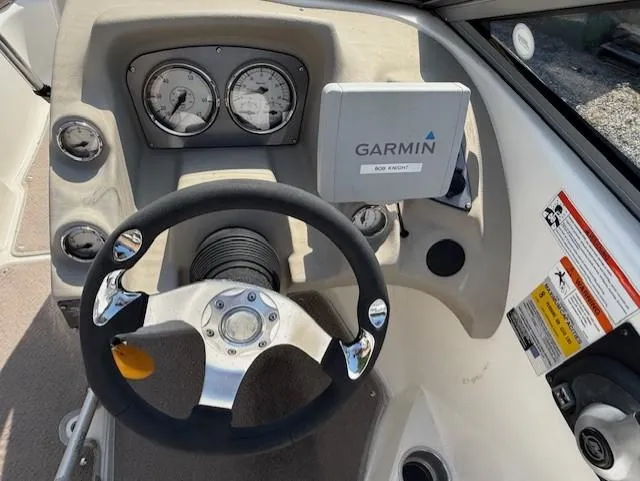 Slide: The Image of Steering wheel and dashboard of 2011 Larson LX 850 boat with Garmin GPS. - 6