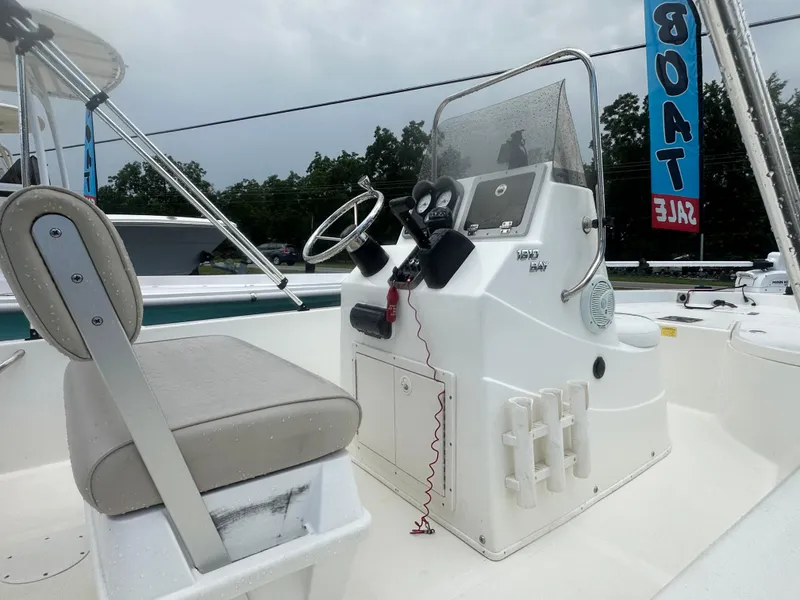 Slide: The Image of 2015 NauticStar 1810 NauticBay boat interior with steering console and seating. - 11