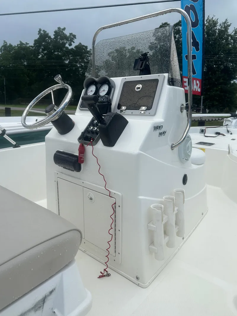 Slide: The Image of 2015 NauticStar 1810 NauticBay boat console with steering wheel and gauges. - 12