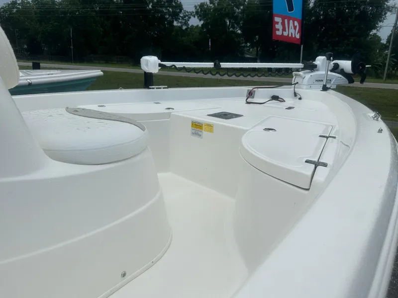 Slide: The Image of 2015 NauticStar 1810 NauticBay boat interior with seating and trolling motor, for sale. - 13