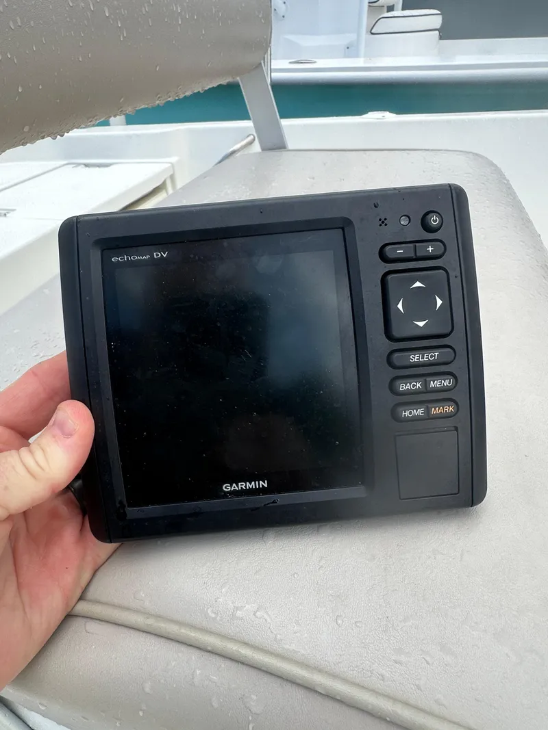 Slide: The Image of Hand holding Garmin echoMAP DV device on 2015 NauticStar 1810 NauticBay boat. - 18
