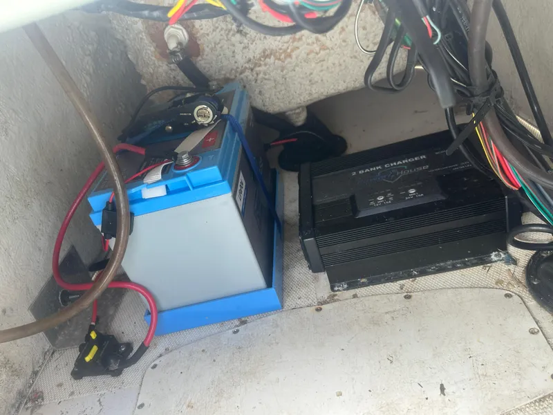 Slide: The Image of Battery and charger setup in 2015 NauticStar 1810 NauticBay boat. - 19