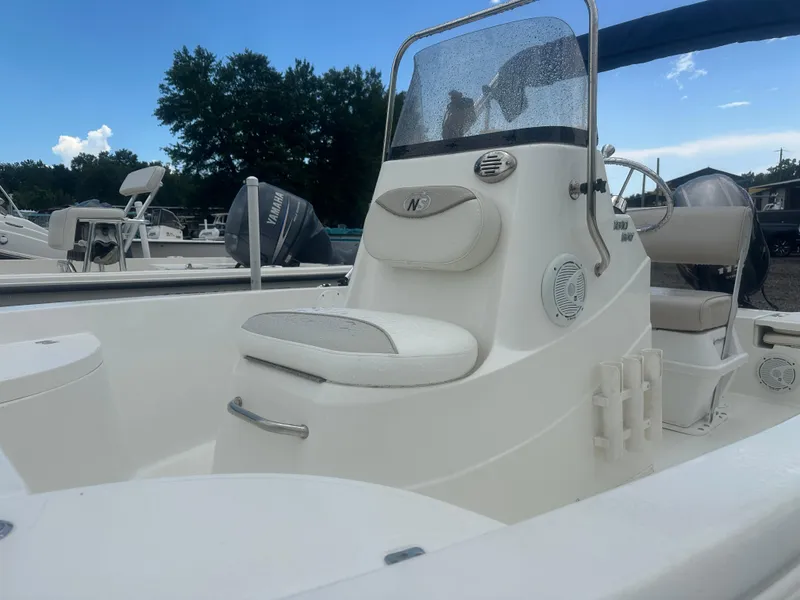 Slide: The Image of 2015 NauticStar 1810 NauticBay boat with Yamaha engine, featuring a sleek white design. - 2
