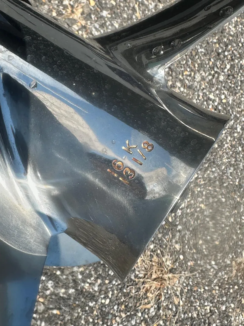 Slide: The Image of Close-up of a 2015 NauticStar 1810 NauticBay boat propeller with engraved specifications. - 26