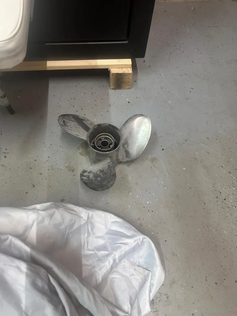 Slide: The Image of Propeller from 2015 NauticStar 1810 NauticBay on concrete floor. - 31