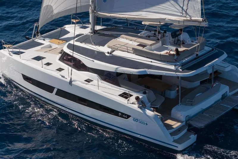 Slide: The Image of 2026 Fountaine Pajot 44 yacht sailing on open sea, featuring spacious deck and modern design. - 1