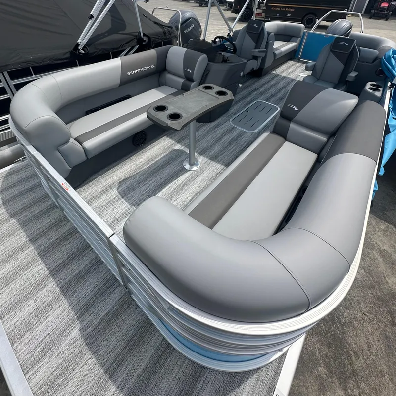 Slide: The Image of 2025 Bennington 22 SSR pontoon boat with spacious seating and modern design. - 6