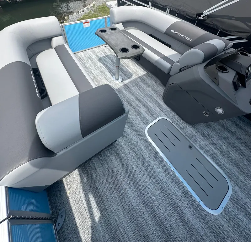 Slide: The Image of 2025 Bennington 22 SSR boat interior with gray seating and table, featuring modern design. - 9