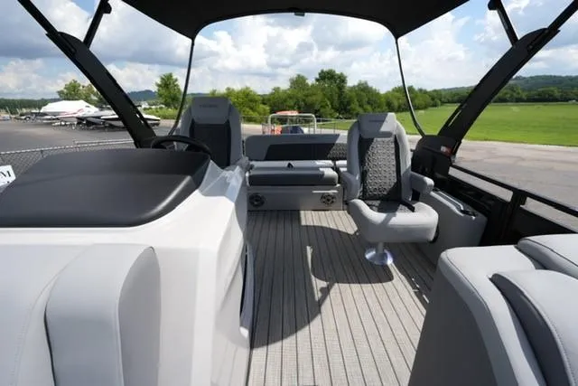 Slide: The Image of 2026 Harris Solstice 250 boat interior with modern seating and sleek design. - 10