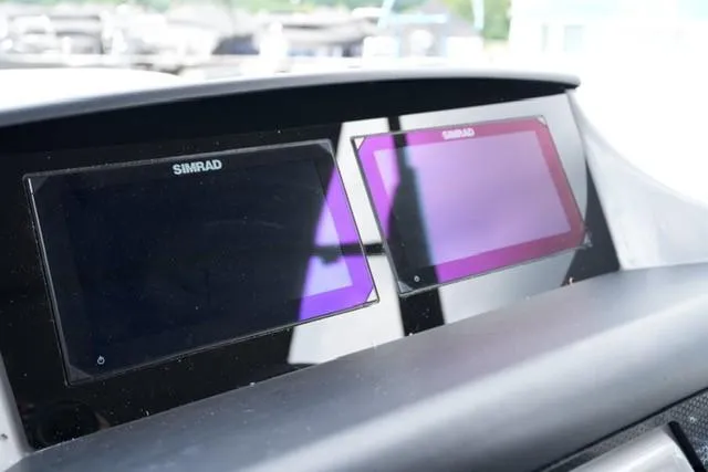 Slide: The Image of Dual Simrad displays on 2026 Harris Solstice 250 boat dashboard. - 13
