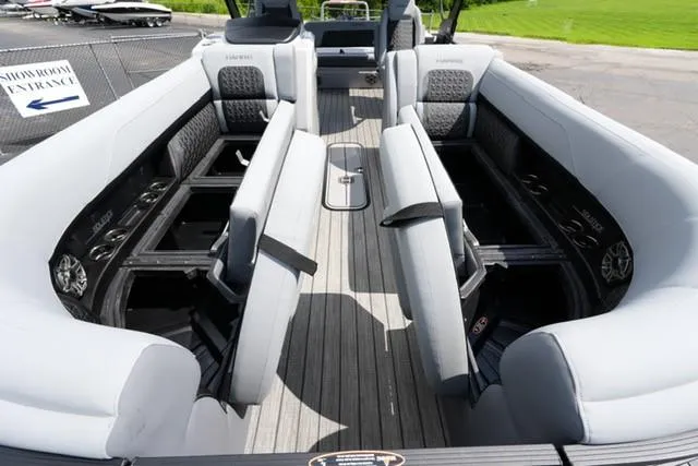 Slide: The Image of 2026 Harris Solstice 250 boat interior with gray seating and modern design. - 9