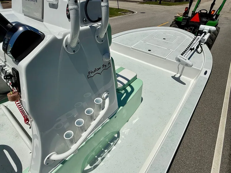 Slide: The Image of 2023 Shallow Sport 24 Sport boat on trailer, featuring sleek design and modern equipment. - 13