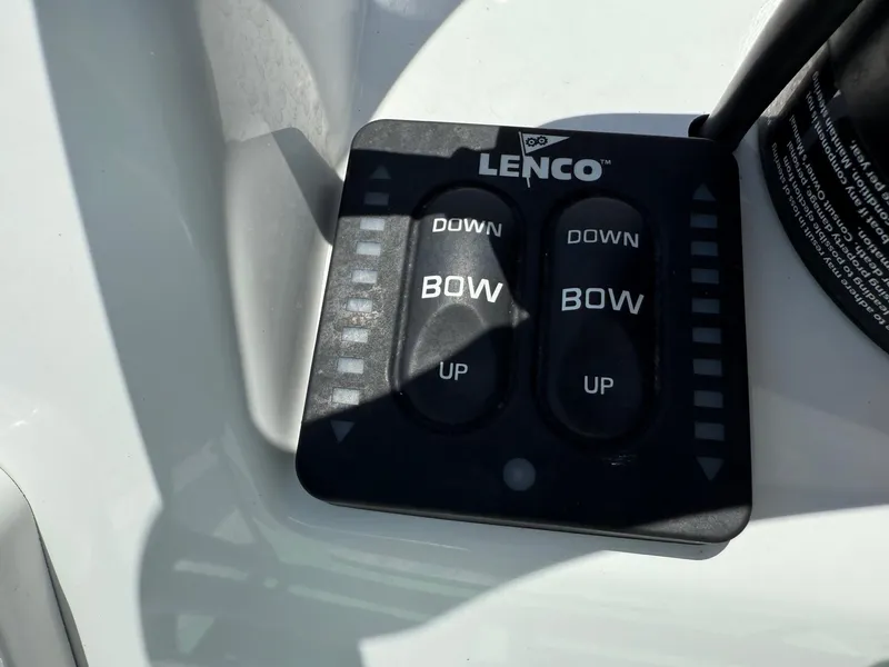 Slide: The Image of Lenco trim tab control panel on 2023 Shallow Sport 24 Sport boat. - 17