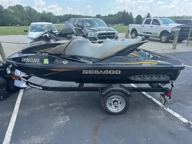 The Image of 2017 Sea-Doo GTX 155 jet ski on trailer in parking lot. - 0