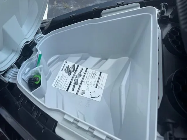 Slide: The Image of Open storage compartment of 2017 Sea-Doo GTX 155 with manual and accessories inside. - 4