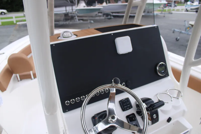 Slide: The Image of Steering console of 2026 Key West 239 FS boat with modern controls and gauges. - 10