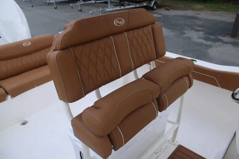 Slide: The Image of 2026 Key West 239 FS boat with luxurious brown leather seating and elegant design. - 12