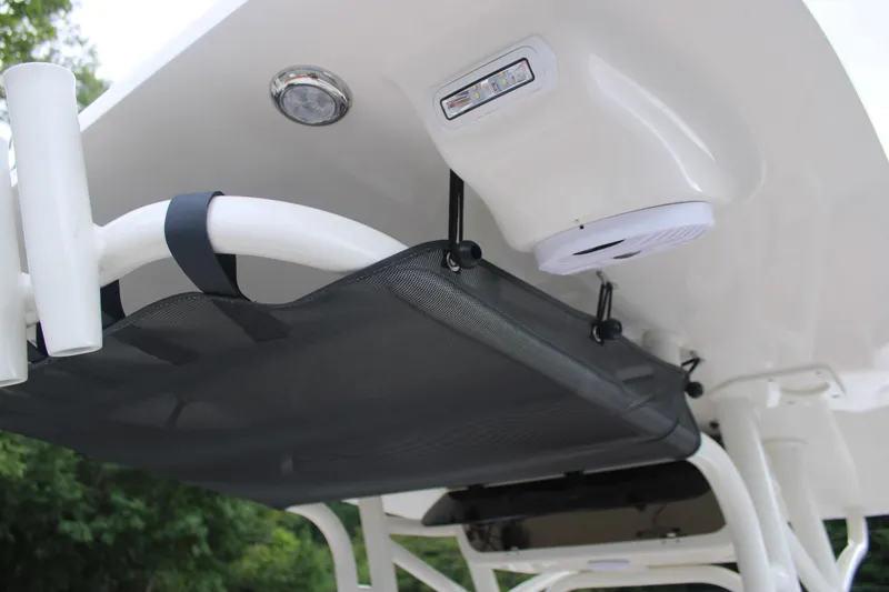 Slide: The Image of 2026 Key West 239 FS boat interior with storage net and lighting. - 14