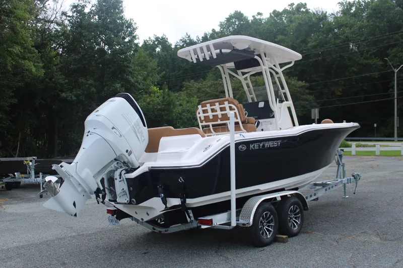 Slide: The Image of 2026 Key West 239 FS boat on trailer, featuring sleek design and powerful outboard motor. - 6