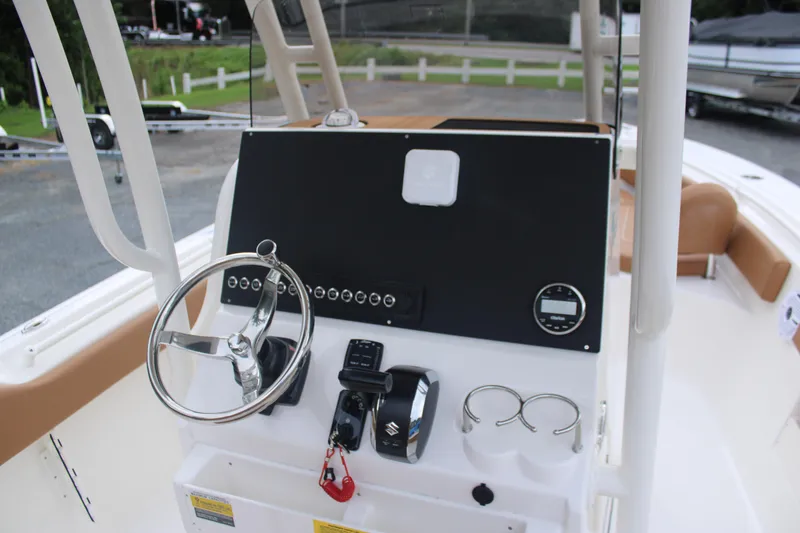 Slide: The Image of 2026 Key West 239 FS boat console with steering wheel and controls. - 9