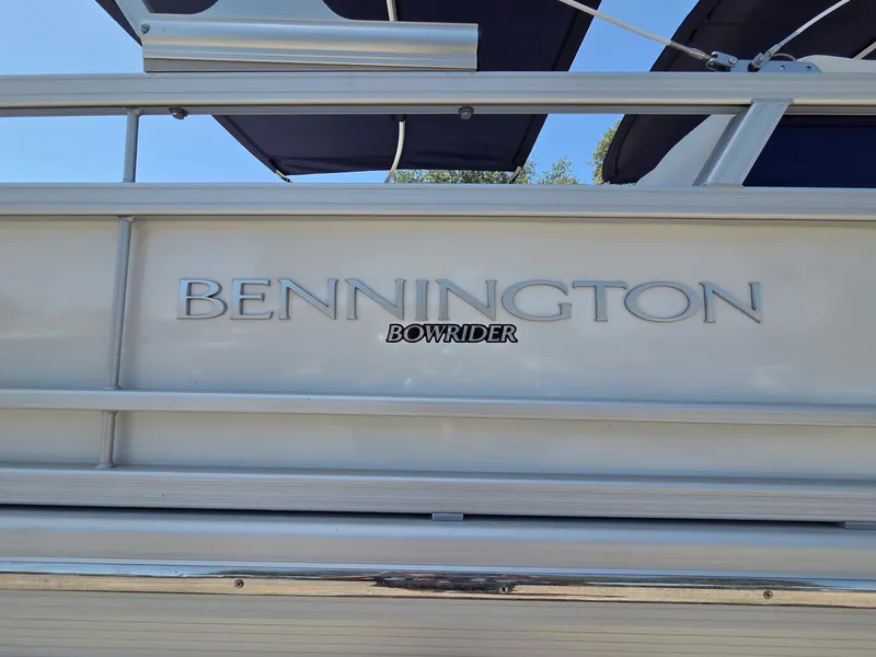 Slide: The Image of 2023 Bennington 25RTSB Bowrider boat, silver exterior with logo. - 3