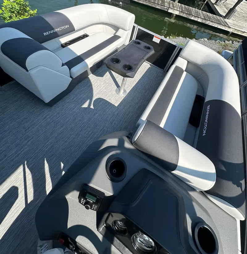 Slide: The Image of 2025 Bennington 22 SSRSE pontoon boat interior with seating and table. - 6