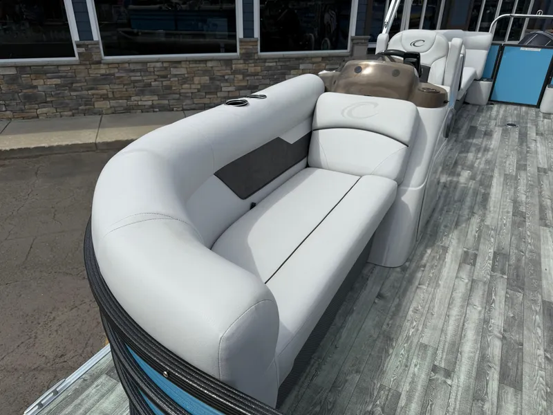 Slide: The Image of 2022 Crest 220 boat interior with sleek white seating and modern design. - 11