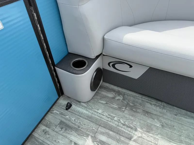 Slide: The Image of 2022 Crest 220 boat interior with cup holder and cushioned seating. - 12