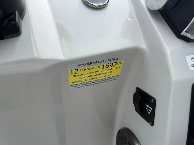 Slide: The Image of 2022 Crest 220 boat capacity label, maximum 12 persons or 1692 lbs. - 21