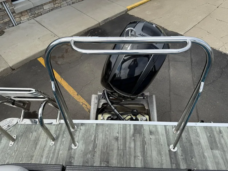 Slide: The Image of 2022 Crest 220 boat with outboard motor and stainless steel railings. - 26