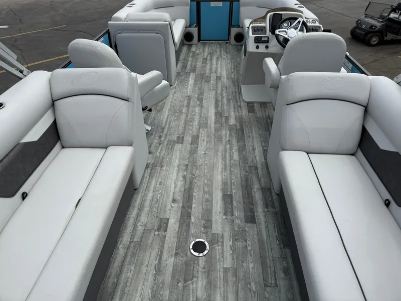Slide: The Image of 2022 Crest 220 boat interior with gray seating and wood-style flooring. - 27