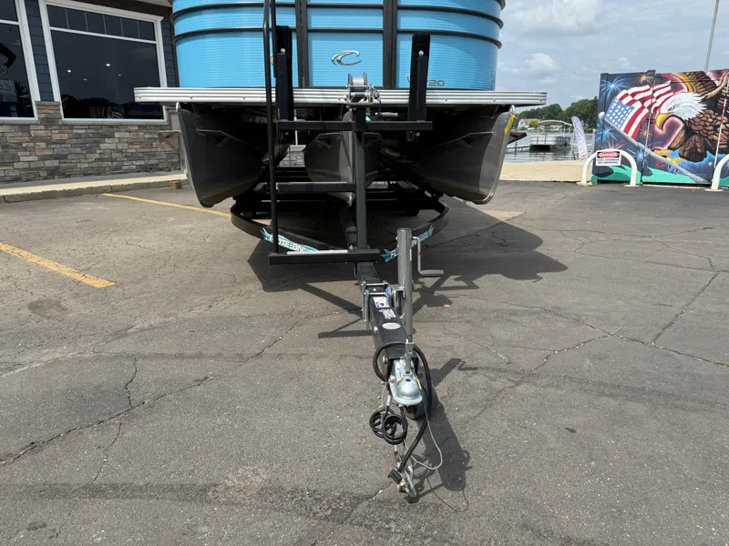 Slide: The Image of 2022 Crest 220 boat on trailer in parking lot, front view. - 3