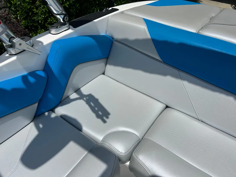 Slide: The Image of 2017 MasterCraft NXT20 boat interior with blue and white seating. - 11