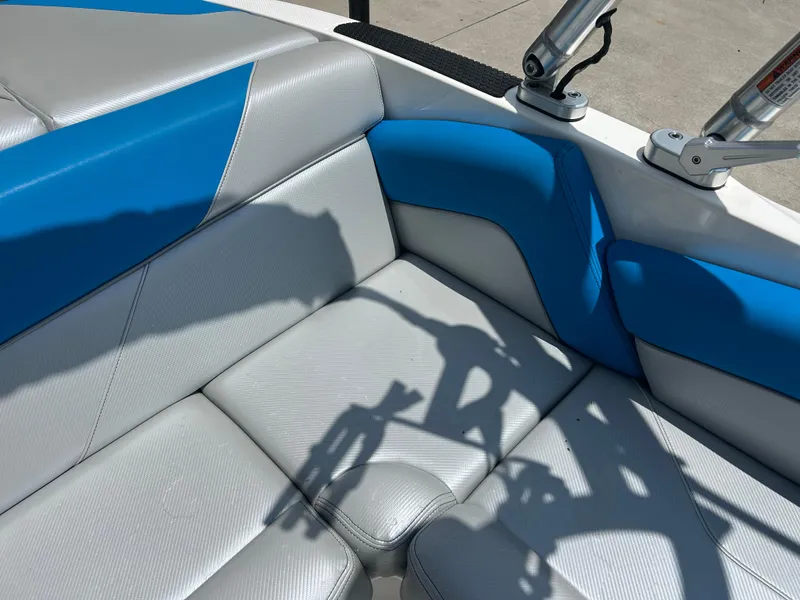 Slide: The Image of 2017 MasterCraft NXT20 boat interior with blue and gray seating. - 14