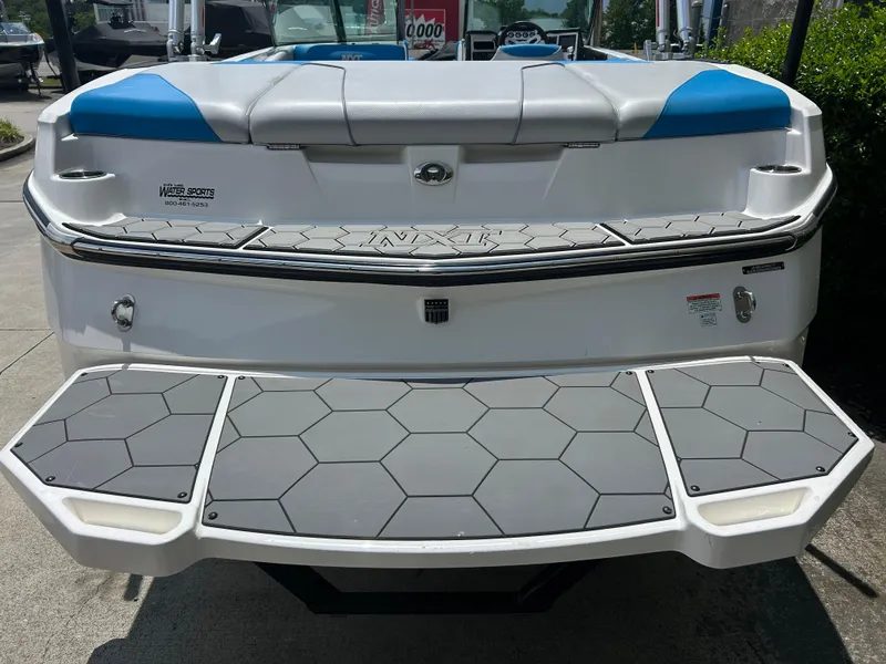Slide: The Image of 2017 MasterCraft NXT20 boat rear view with swim platform and seating. - 6