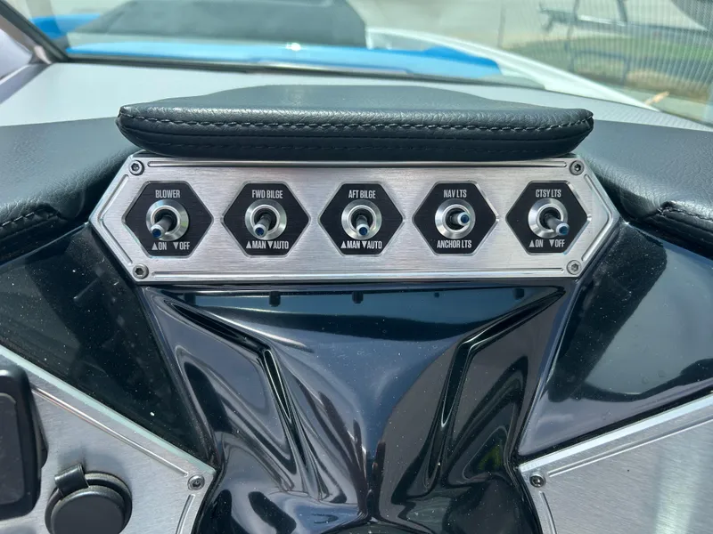 Slide: The Image of Control panel of a 2017 MasterCraft NXT20 boat with various switches. - 9