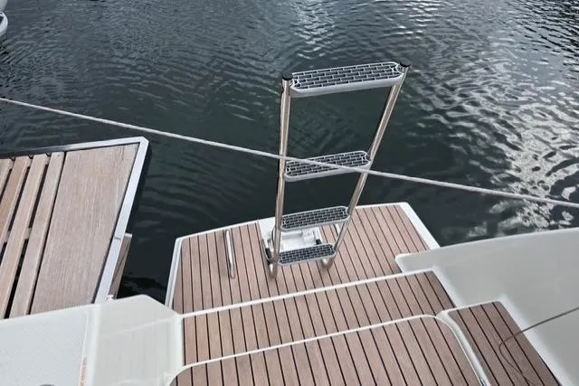 Slide: The Image of 2022 Fountaine Pajot Tanna 47 yacht with teak deck and swim ladder. - 10
