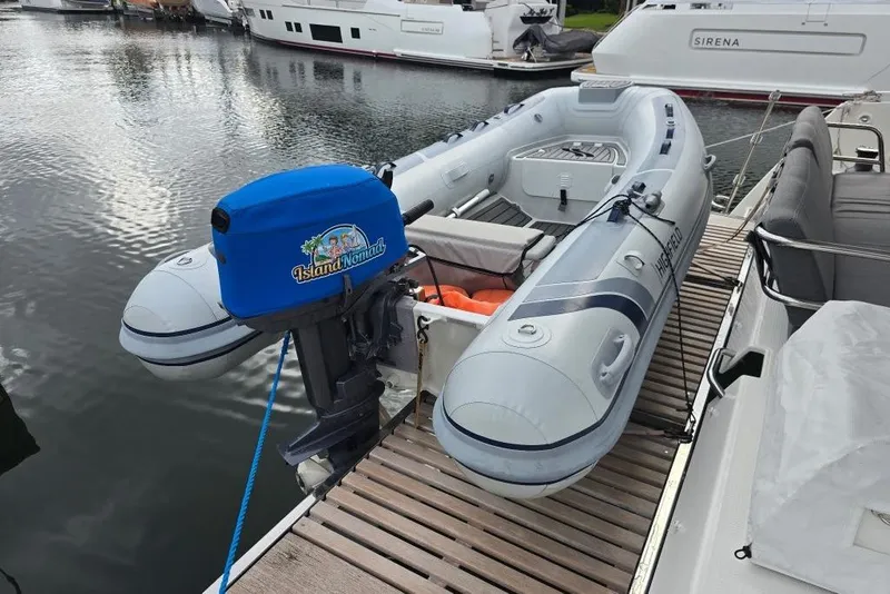 Slide: The Image of Inflatable boat with outboard motor on Fountaine Pajot Tanna 47, 2022 model. - 11