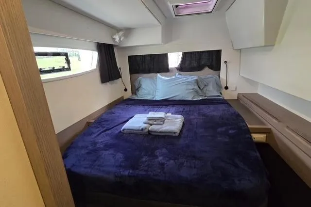Slide: The Image of Luxurious bedroom interior of 2022 Fountaine Pajot Tanna 47 yacht with cozy bedding. - 13