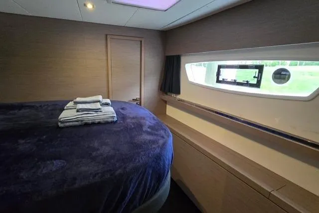 Slide: The Image of Luxurious cabin interior of 2022 Fountaine Pajot Tanna 47 yacht with plush bedding. - 14