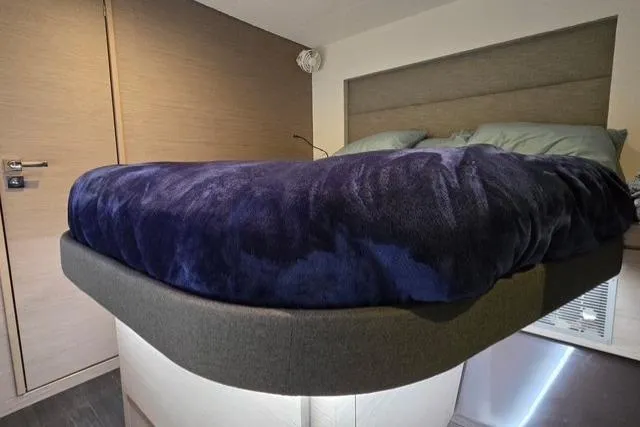 Slide: The Image of Luxurious bedroom interior of 2022 Fountaine Pajot Tanna 47 catamaran with plush bedding. - 17