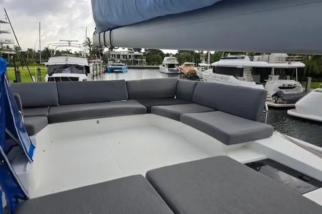 Slide: The Image of 2022 Fountaine Pajot Tanna 47 yacht with spacious outdoor seating area in marina. - 30
