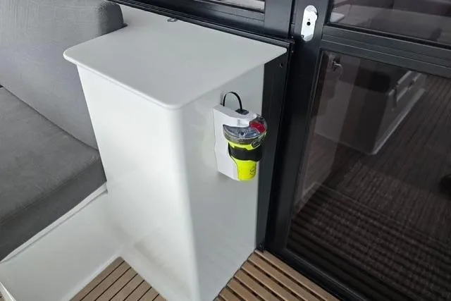 Slide: The Image of 2022 Fountaine Pajot Tanna 47 interior with modern seating and safety equipment. - 31