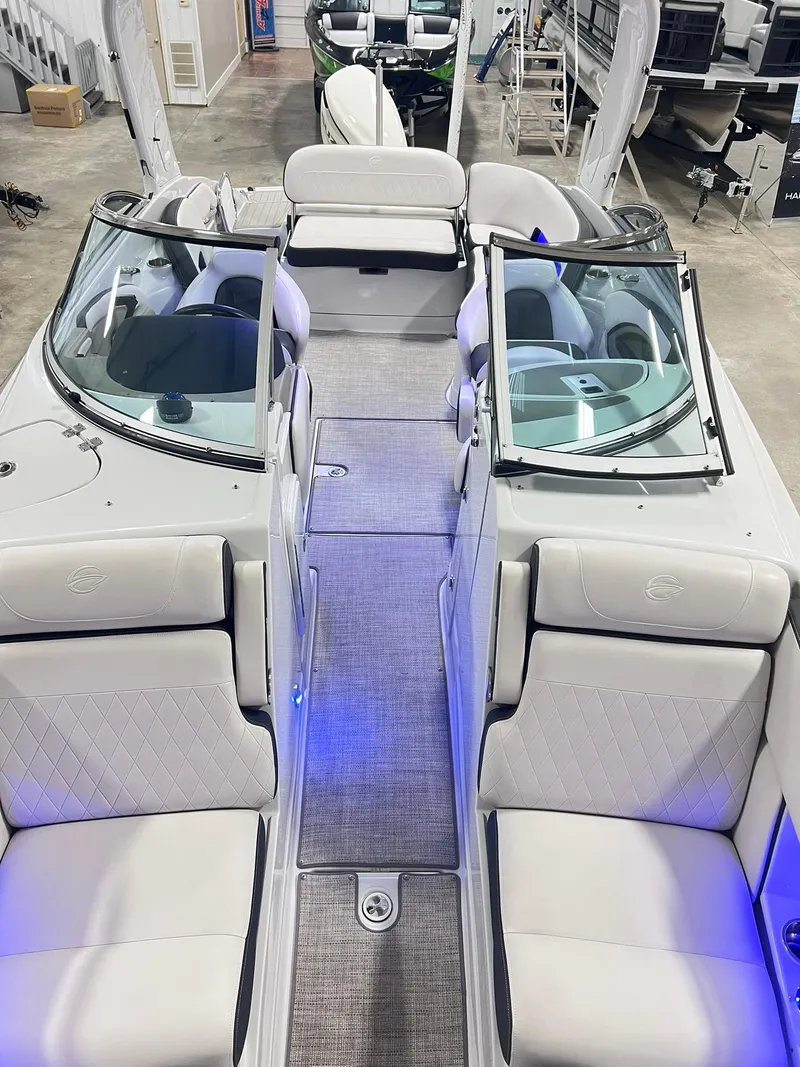 Slide: The Image of 2020 Crownline Eclipse E225 XS boat interior with plush seating and modern design. - 13