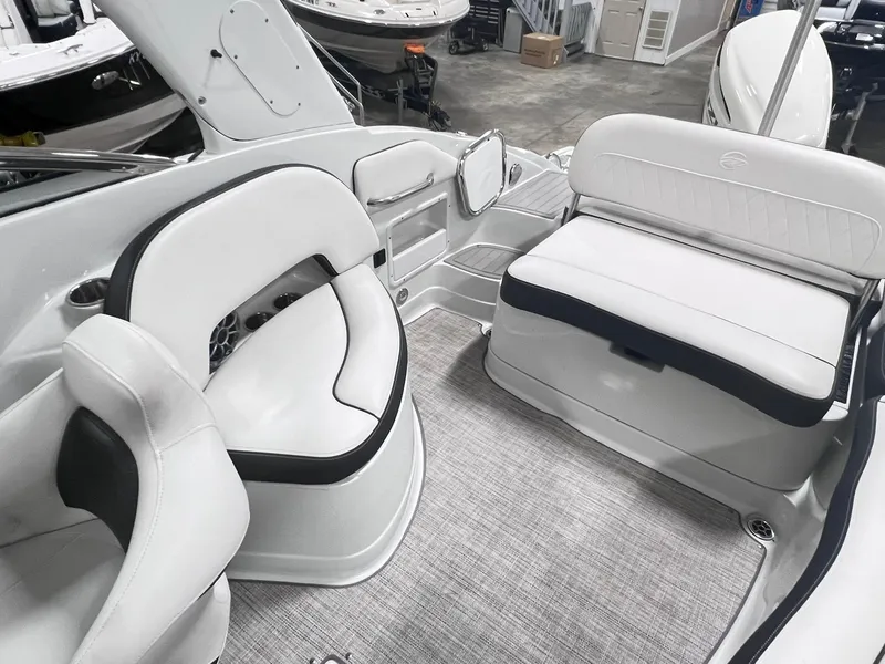 Slide: The Image of 2020 Crownline Eclipse E225 XS boat interior with white seating and modern design. - 17